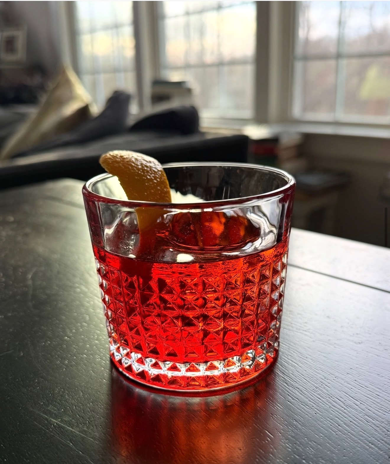 A custom cocktail with citrus and herbs